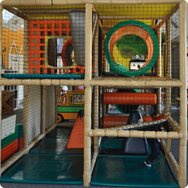 Indoor playground structure with tunnels and climbing areas