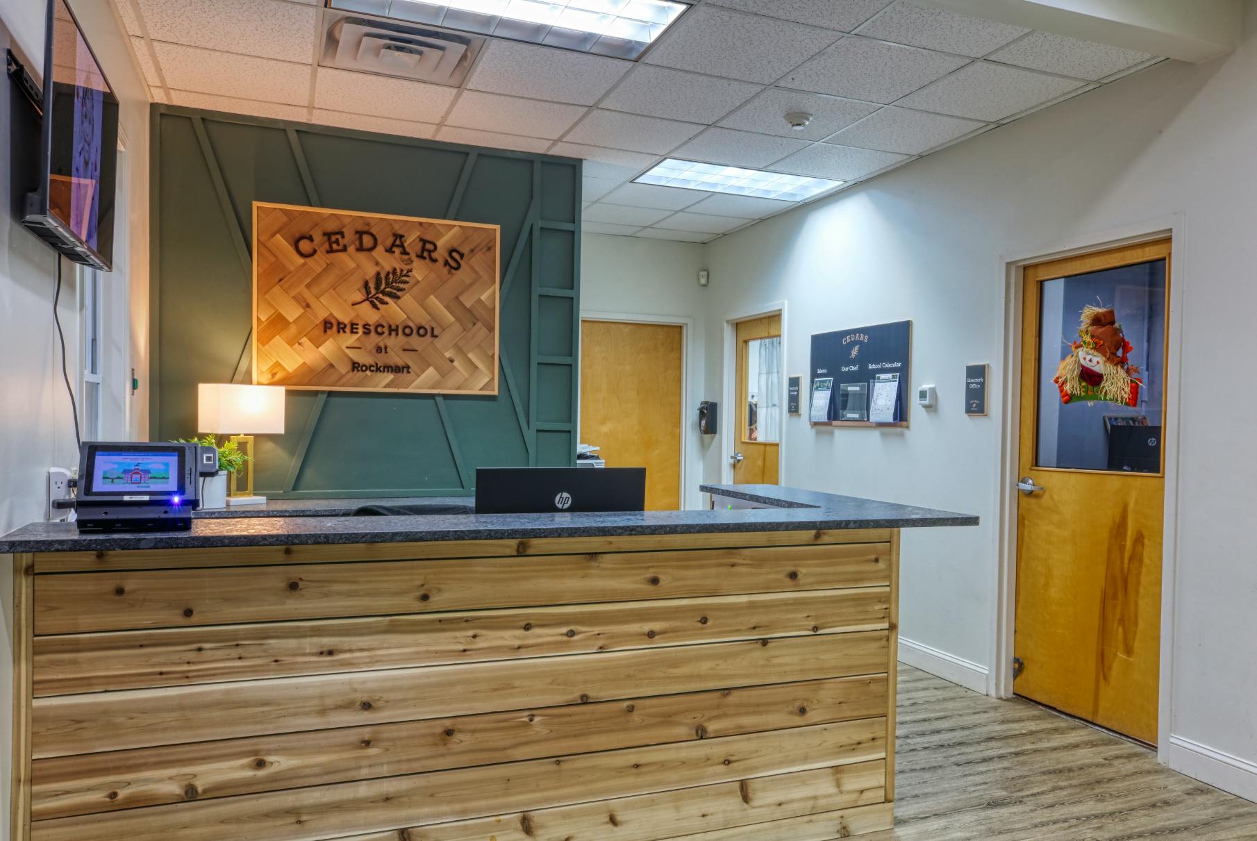 Reception desk with "Cedars Preschool at Rockmart" sign