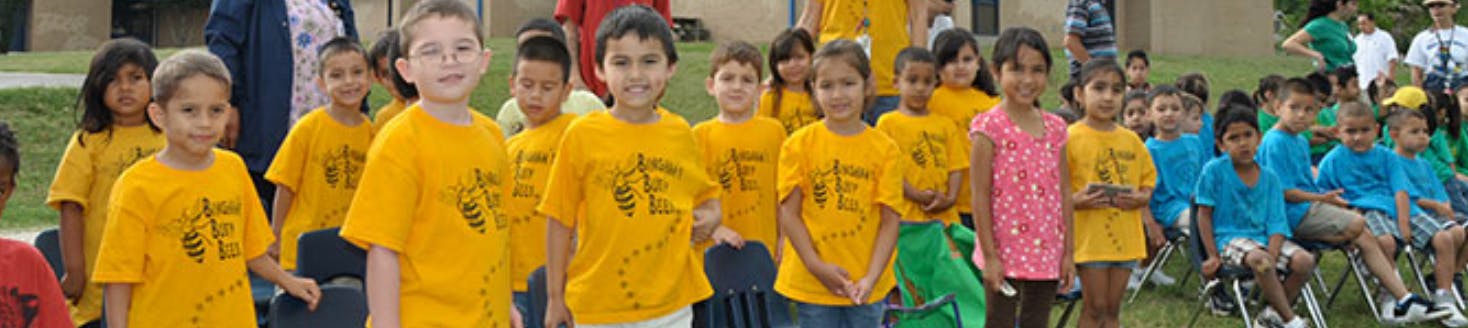 Group of children in yellow and blue shirts