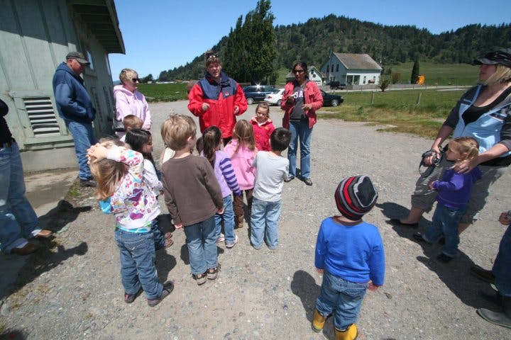 Adults and children gathered outdoors