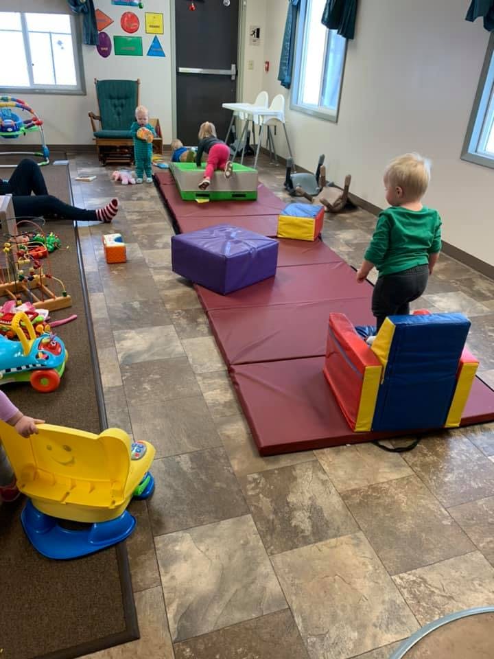 Children playing with toys in a room