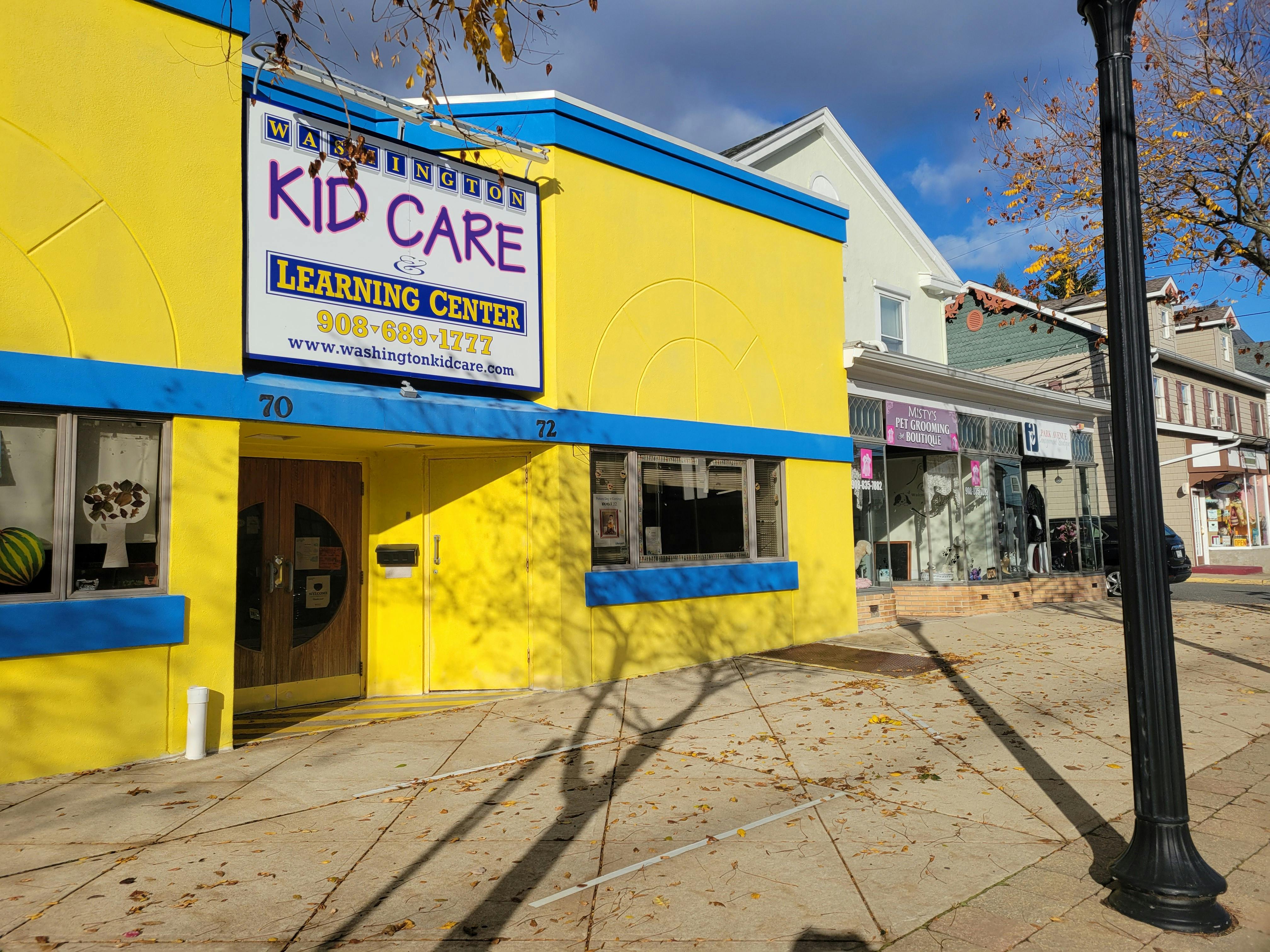 Building with a "Kid Care Learning Center" sign