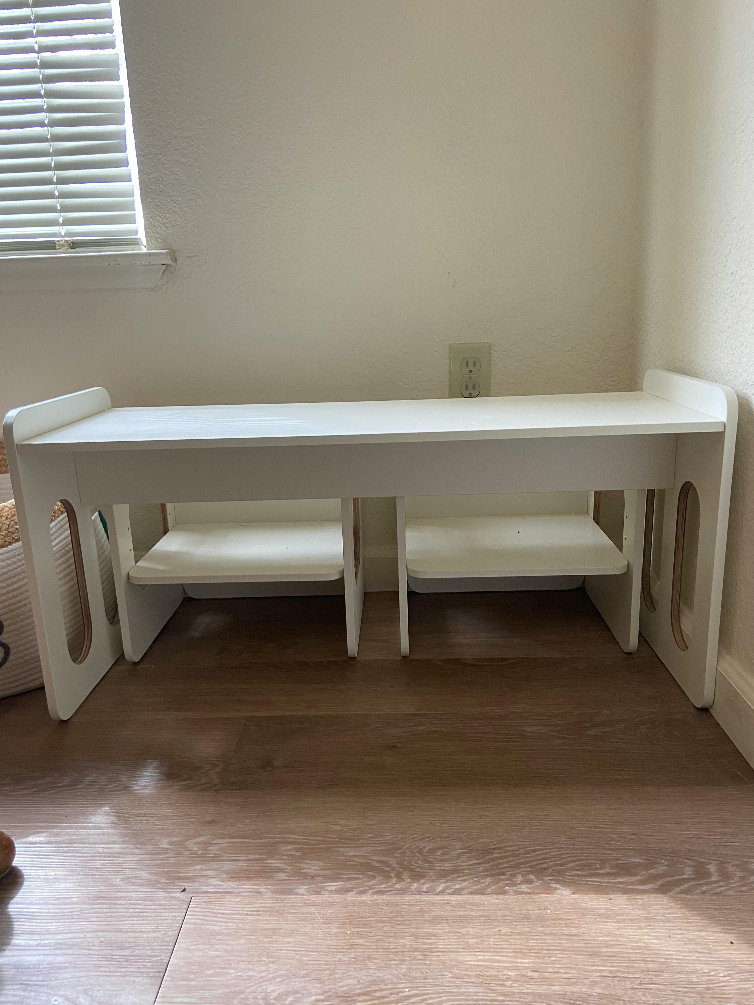 White children's activity table with two chairs underneath