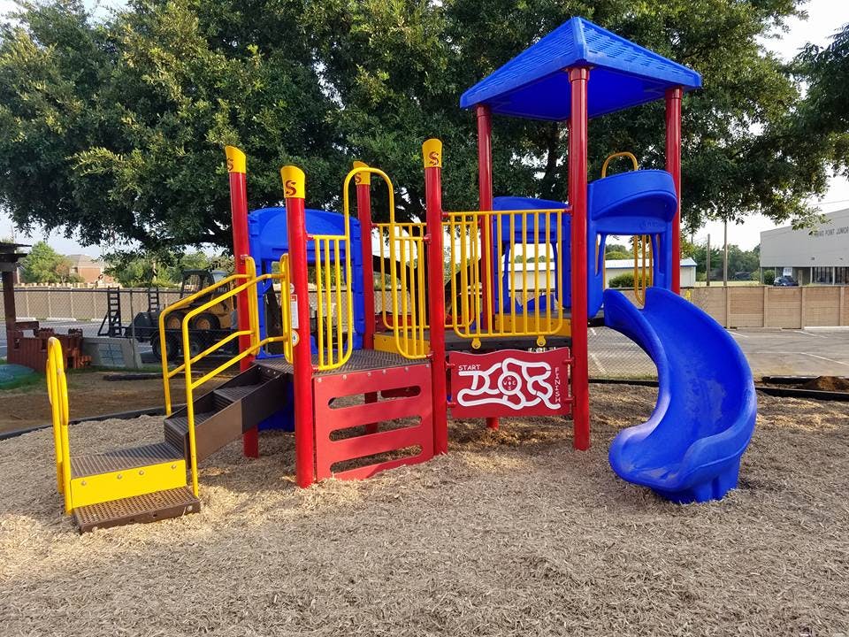 Playground structure with slides and climbing areas