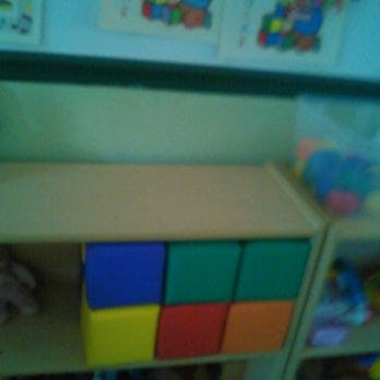 Six colorful blocks on a shelf