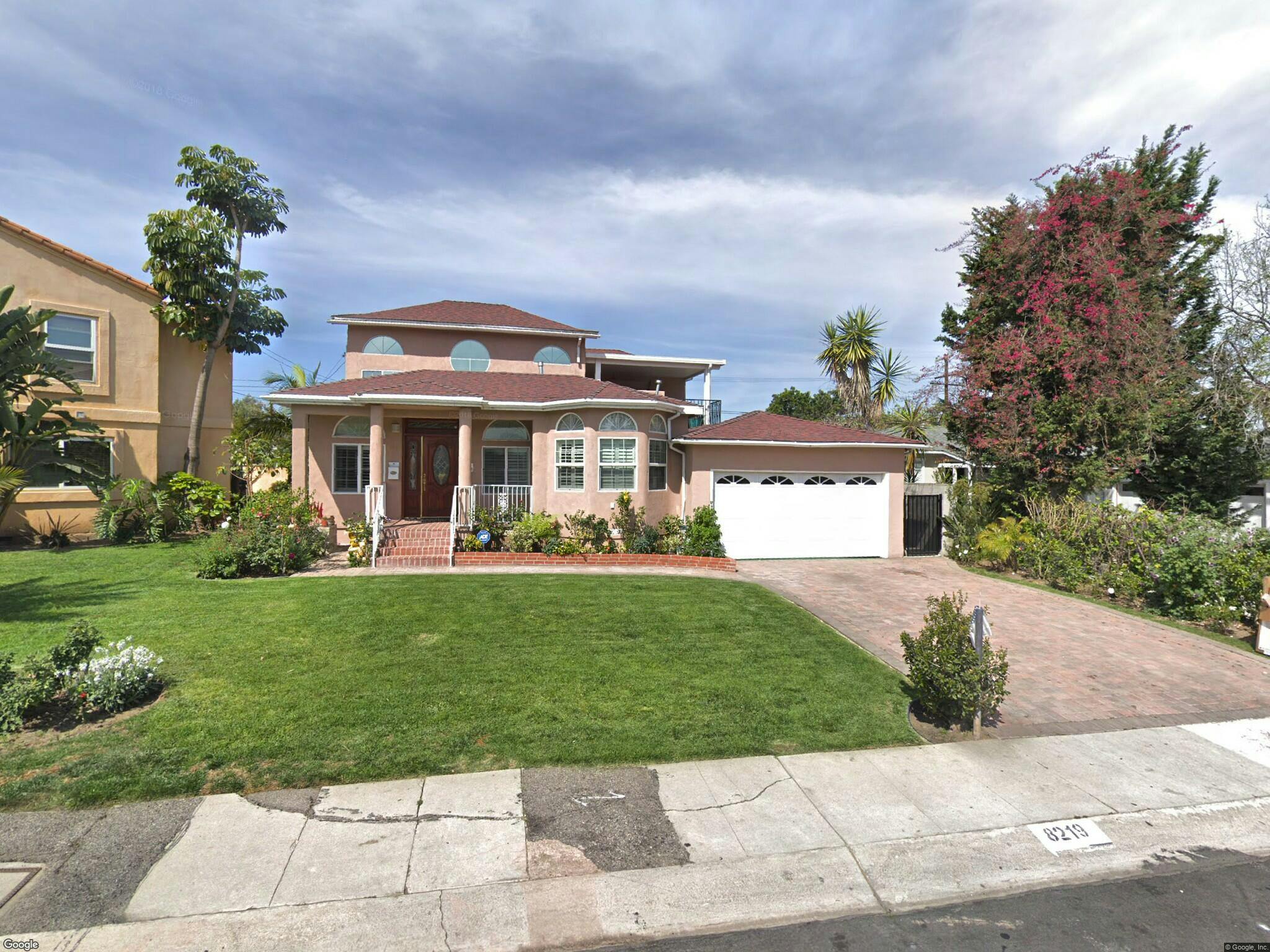 House with a front lawn and an attached garage