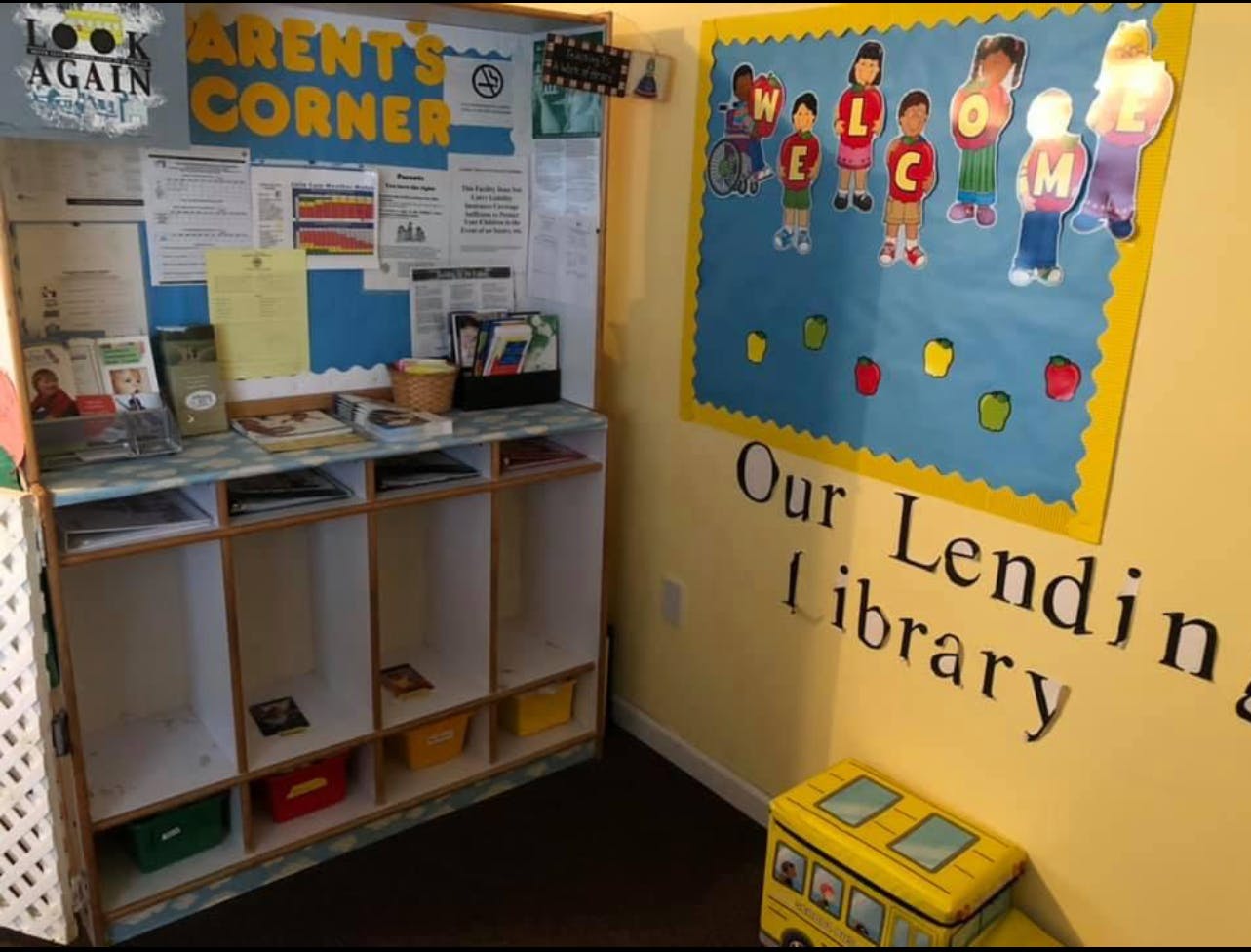 Parents' Corner bulletin board and lending library wall in a classroom