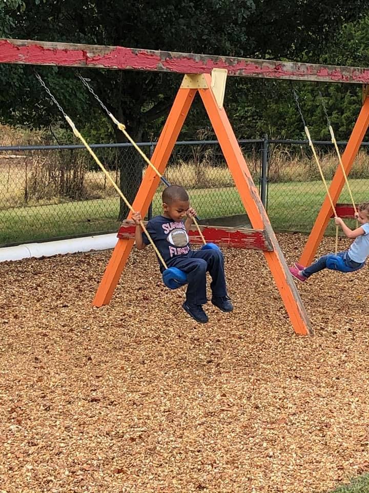 Child on a swing set