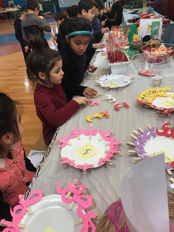 Children making crafts at a table