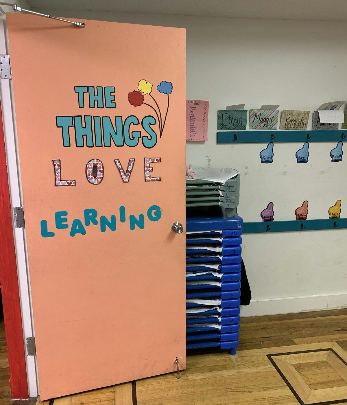 Door with "THE THINGS LOVE LEARNING" text