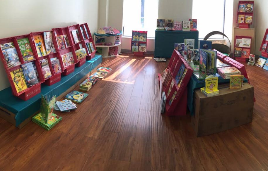 Books displayed on shelves and tables in a room