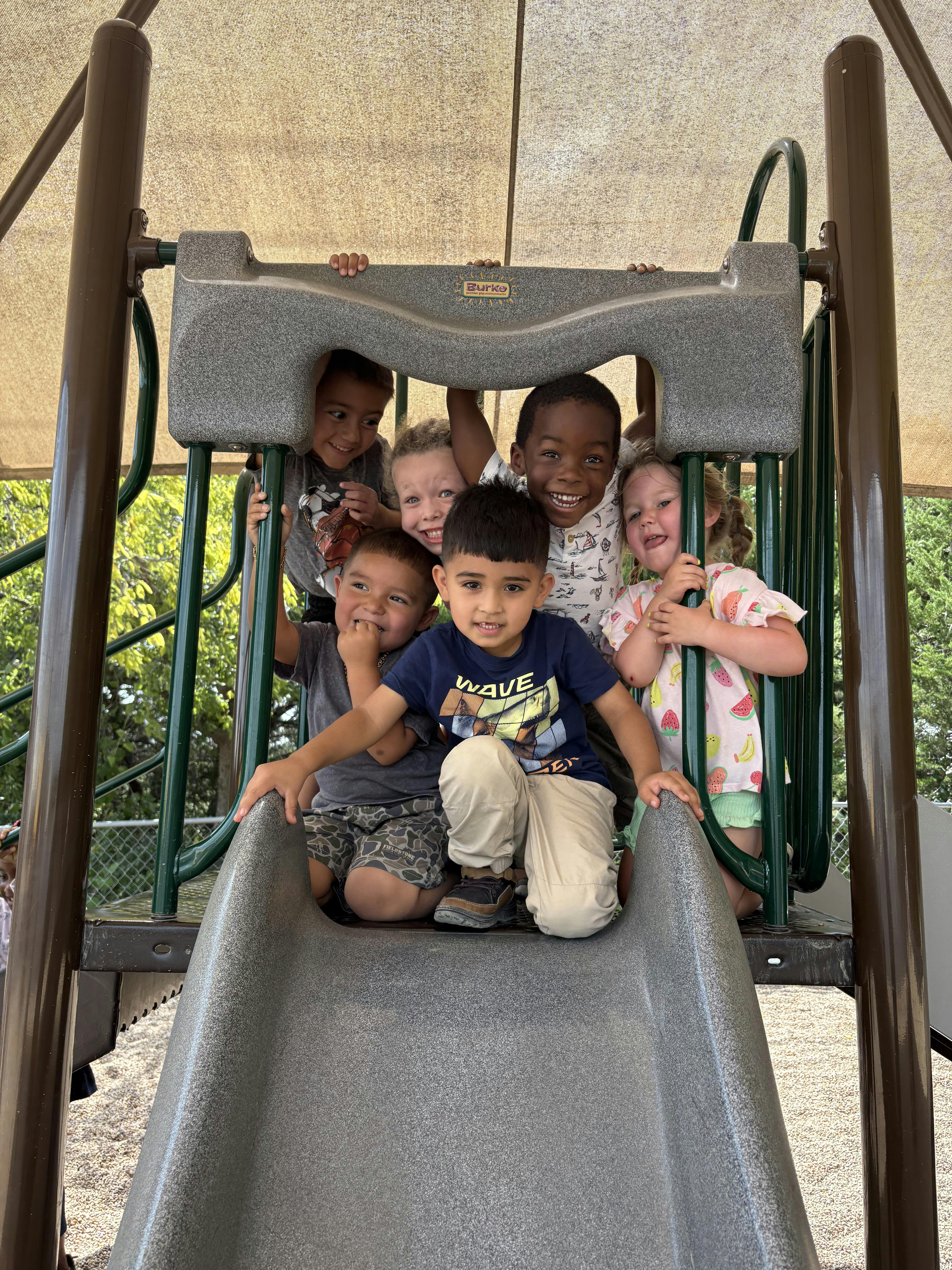 Group of children on a playground slide