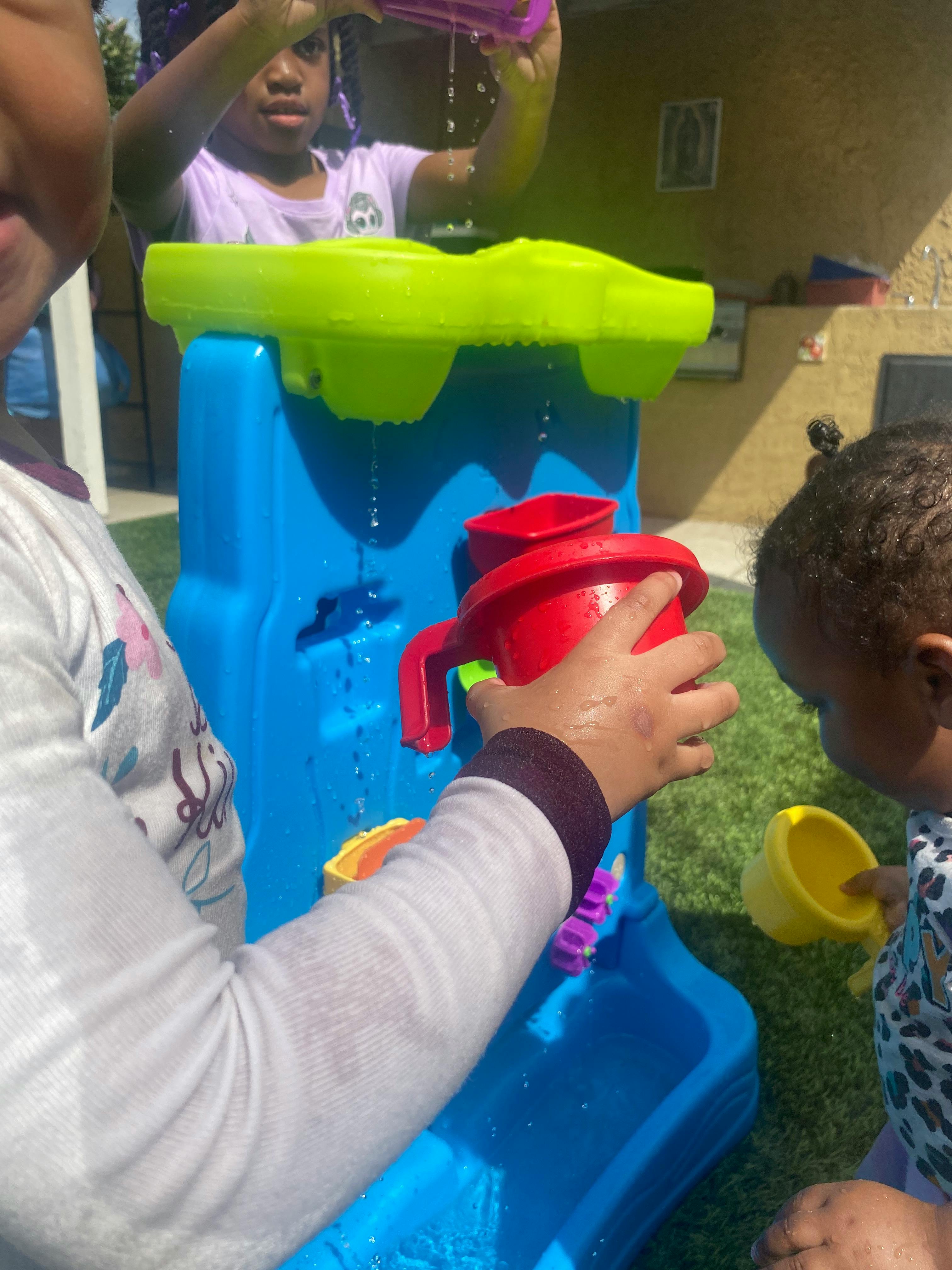 Children playing with a water table