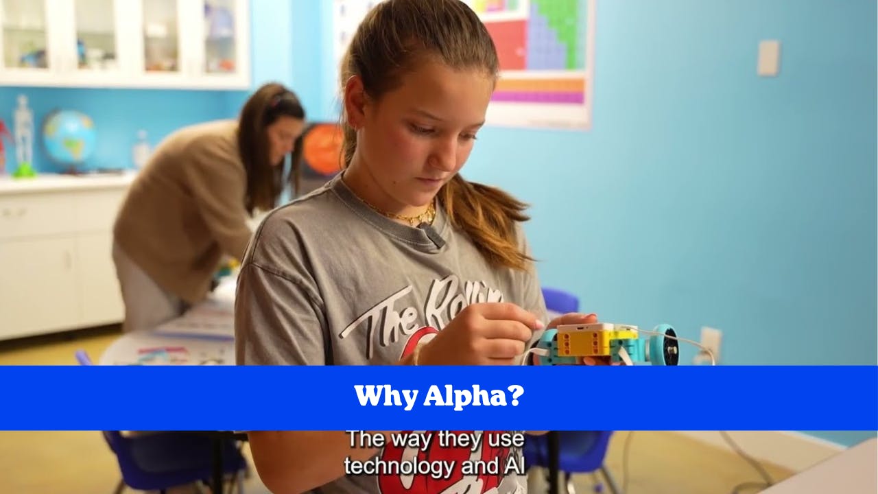 Teen working on a small robot with another person in the background