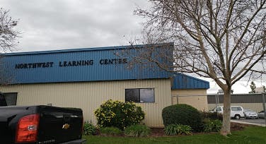 Building with "NORTHWEST LEARNING CENTRE" on its facade