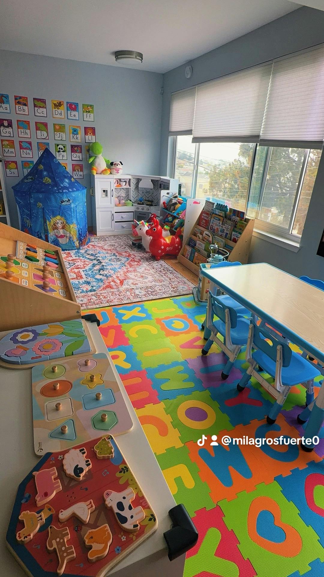 Colorful playroom featuring educational toys, puzzles, and a children's table