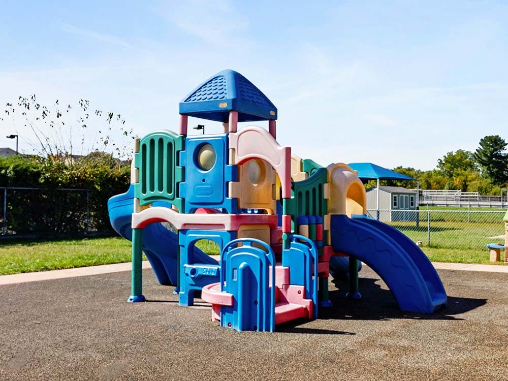 Colorful playground structure with slides on a sunny day