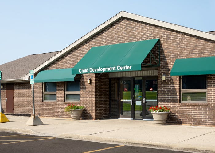 Child Development Center building with green awnings