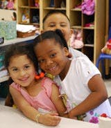 Three children in a classroom