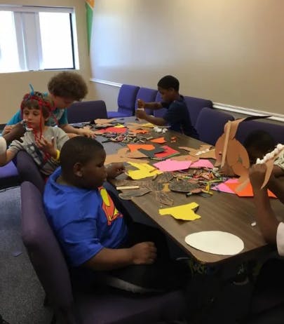 Children doing crafts at a table