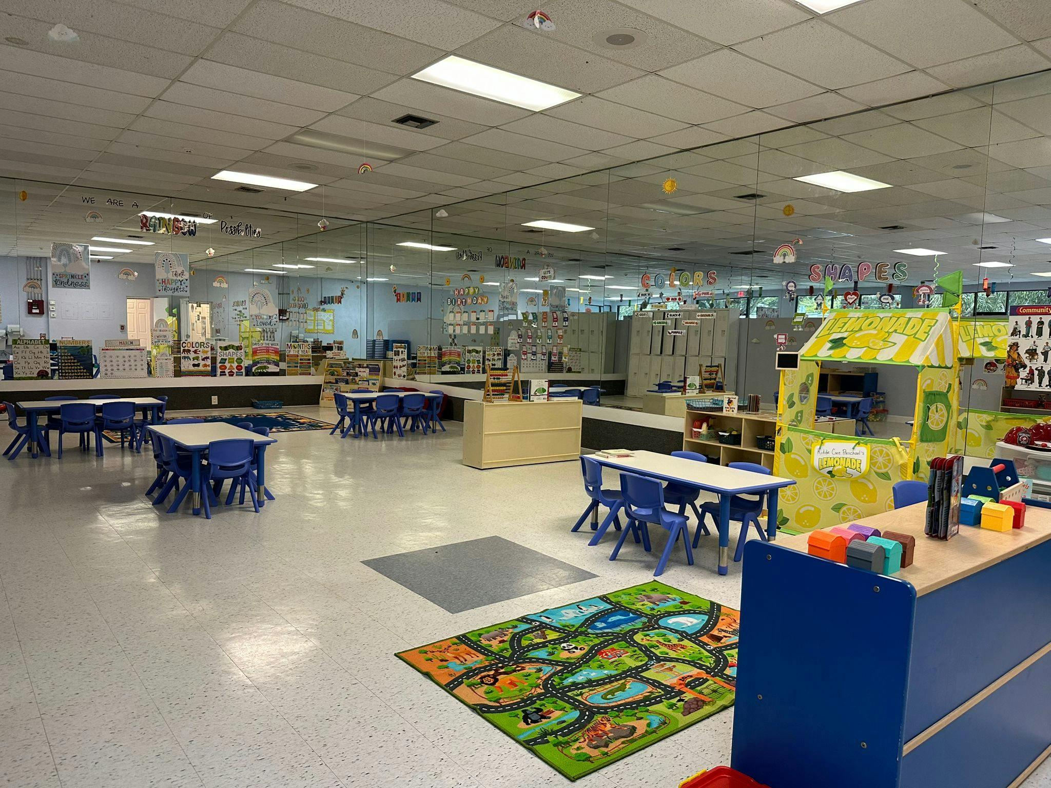 Empty classroom with small tables and chairs