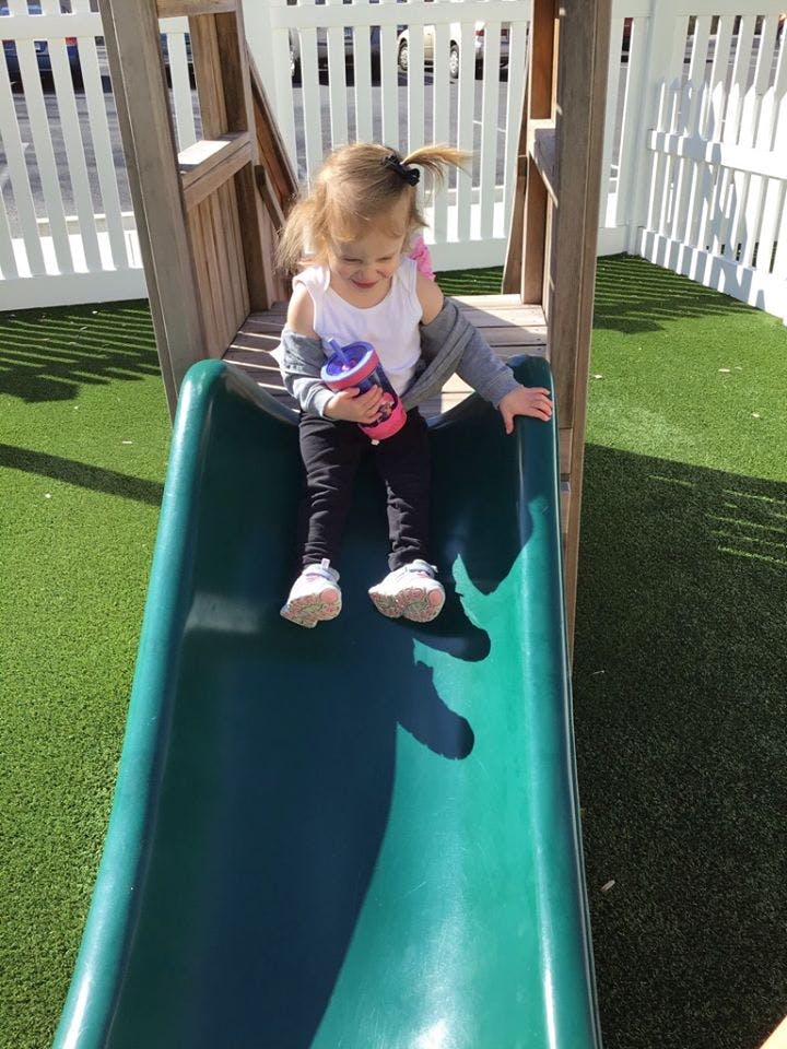 Child on a playground slide