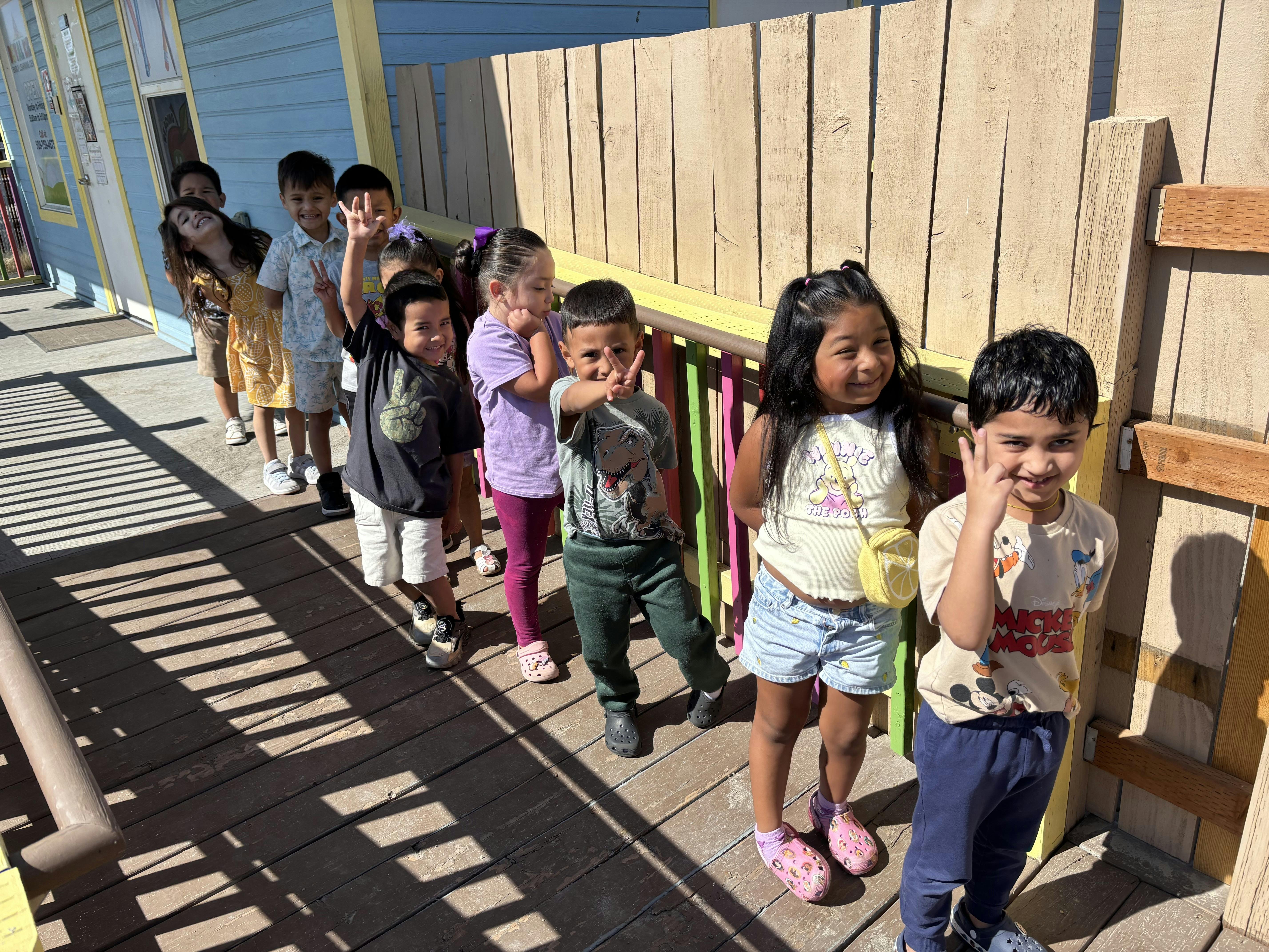 Group of children standing in a line outdoors