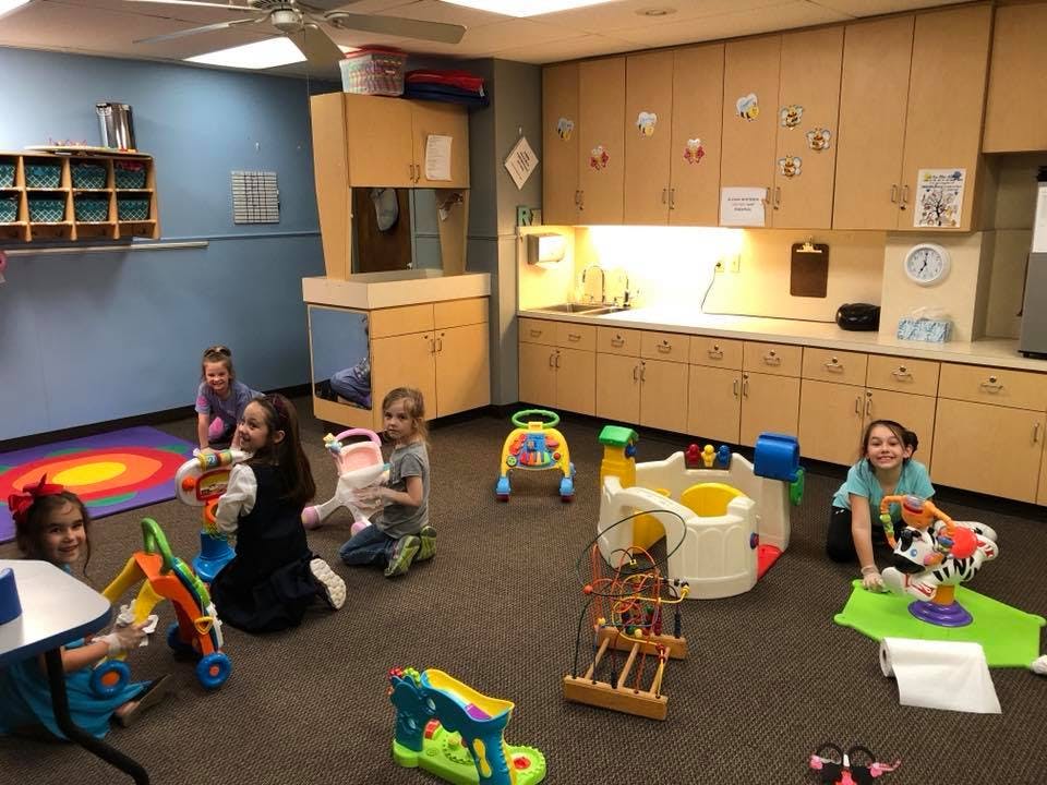 Children playing with toys in a room