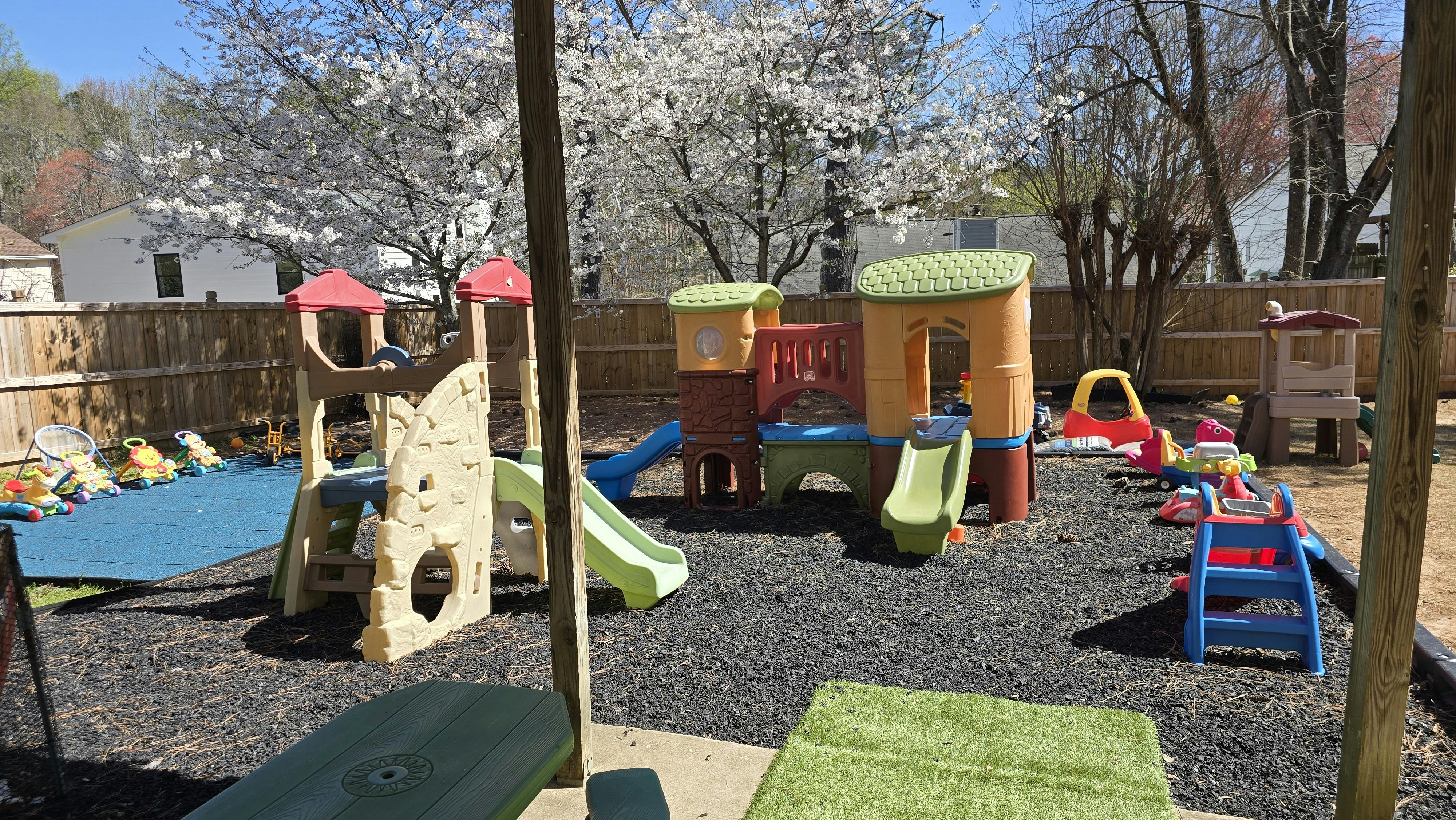 Outdoor playground with colorful play structures and slides