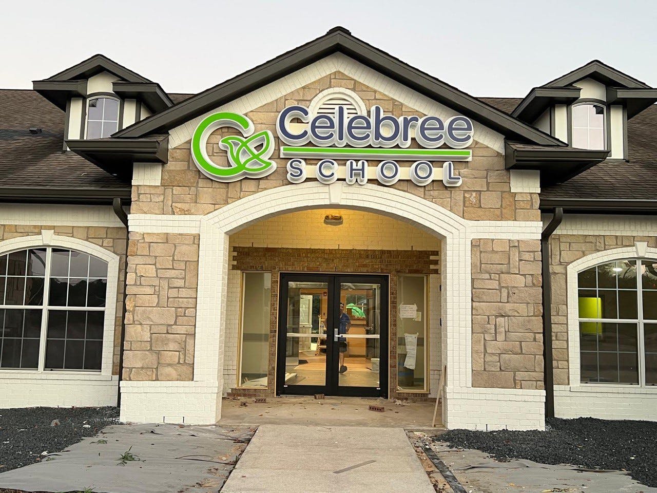 Building exterior with Celebree School sign above entrance