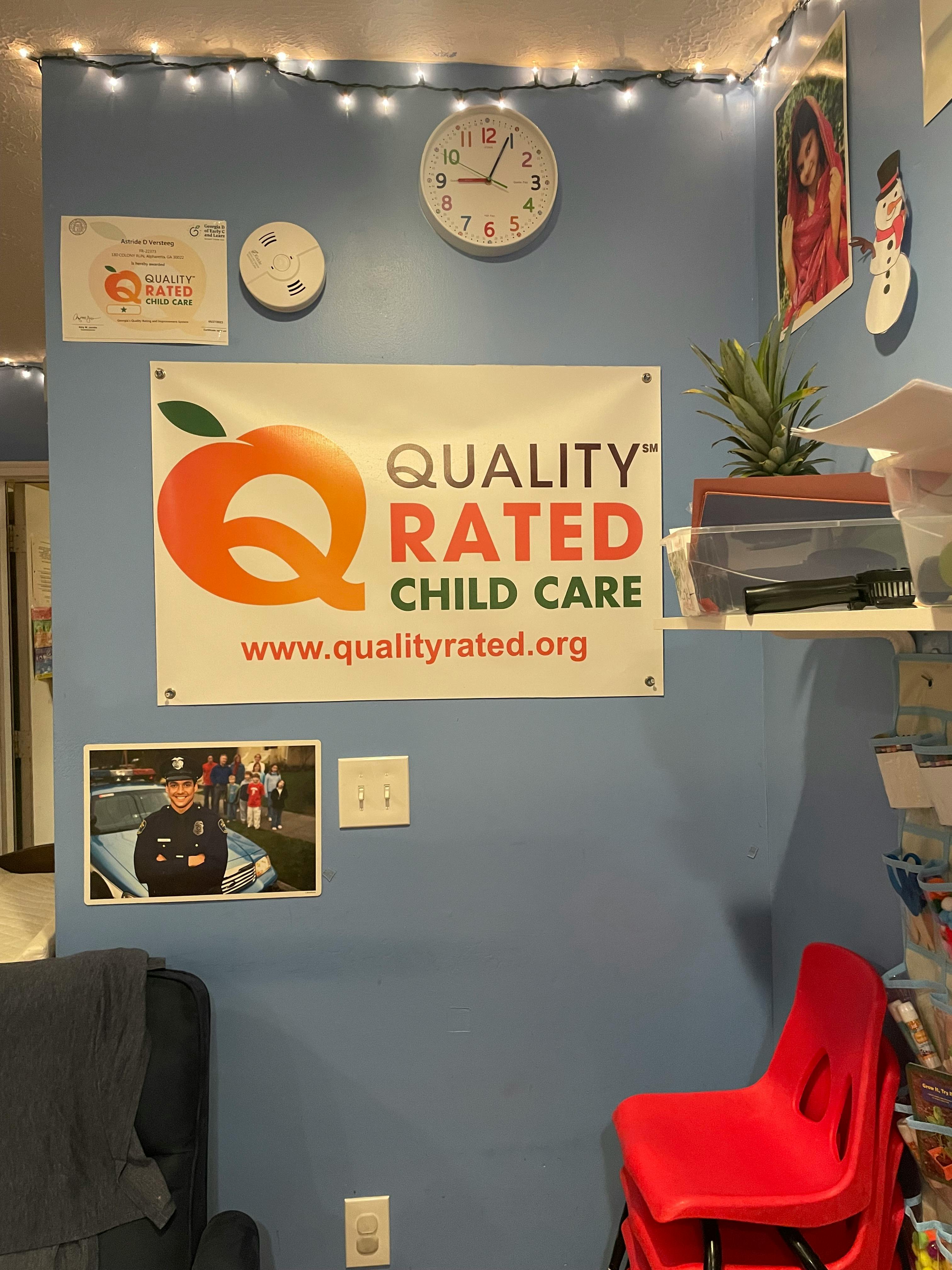 Quality Rated Child Care banner on a blue wall