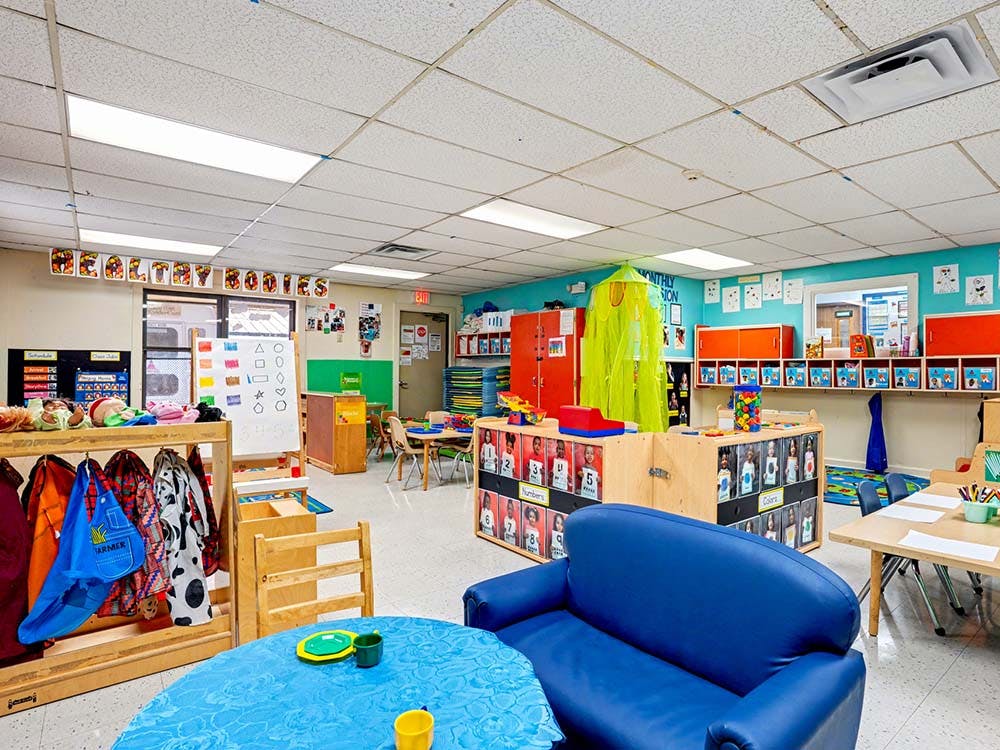 Colorful classroom with child-sized furniture and learning materials