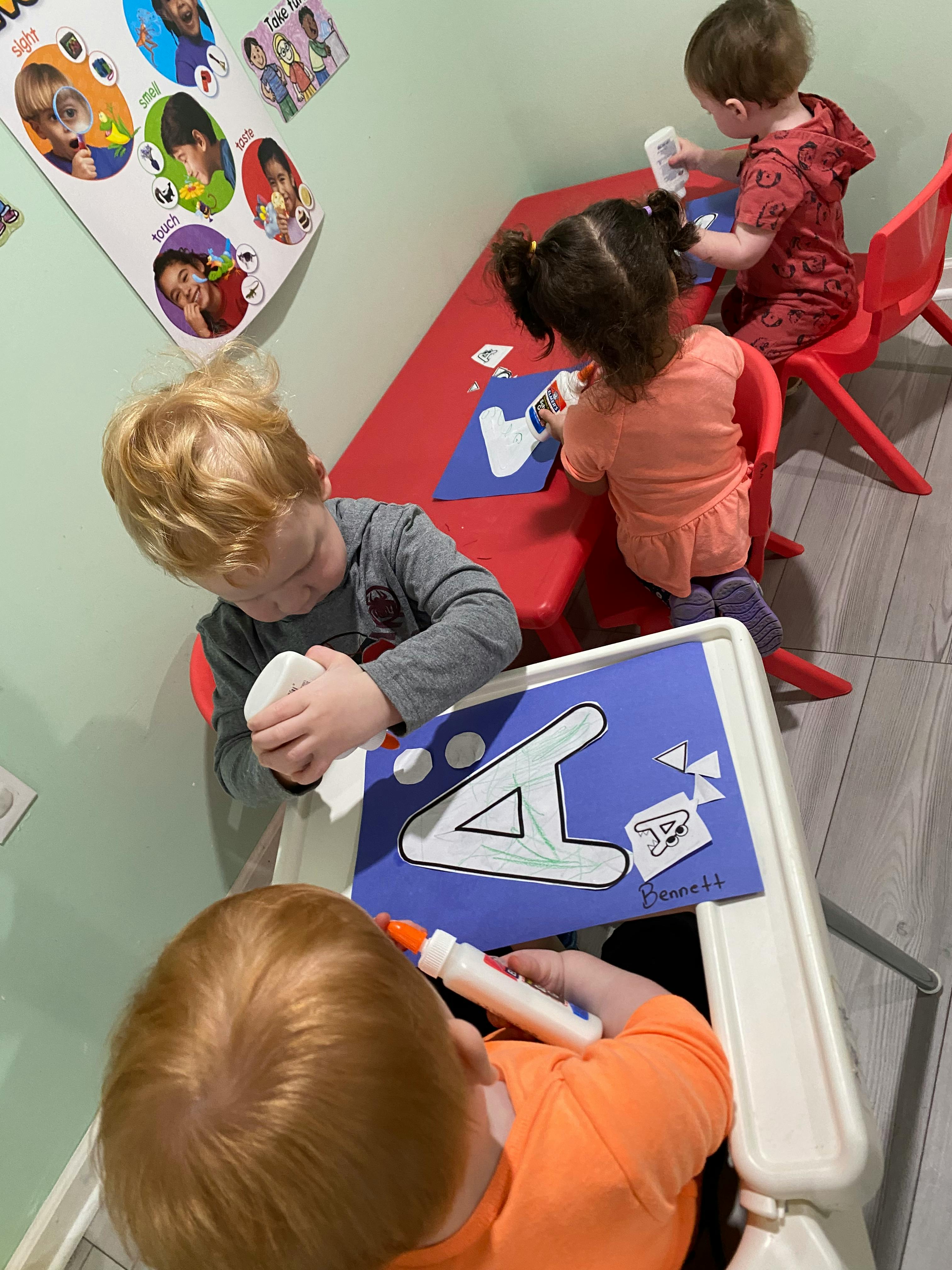 Children doing crafts at a table
