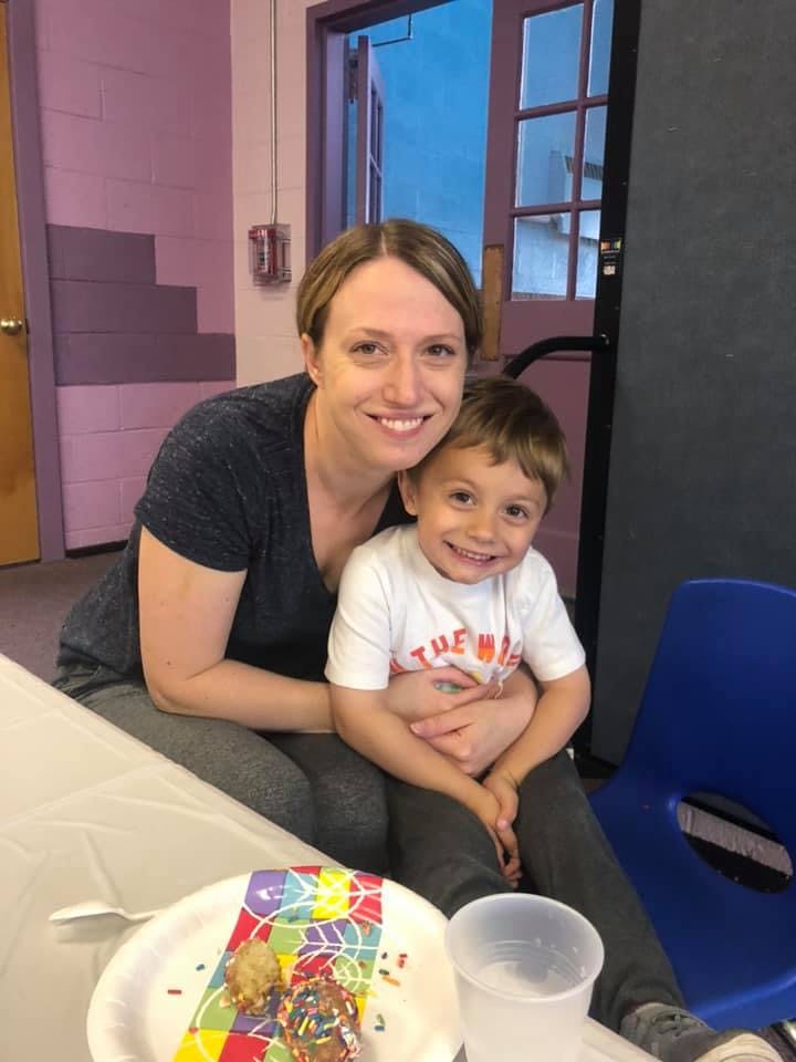 Adult and child sitting together