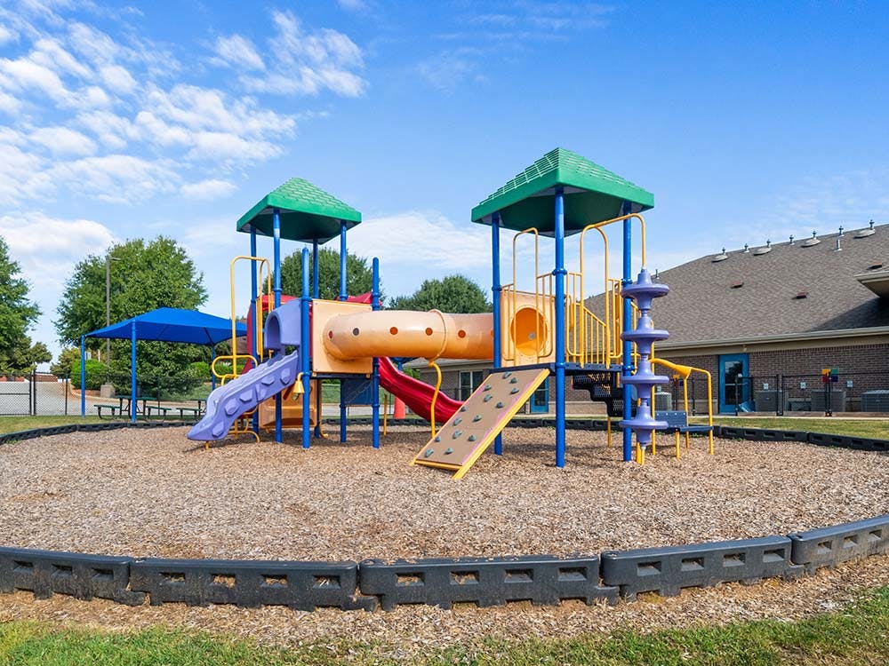 Colorful outdoor playground with slides and climbing structures