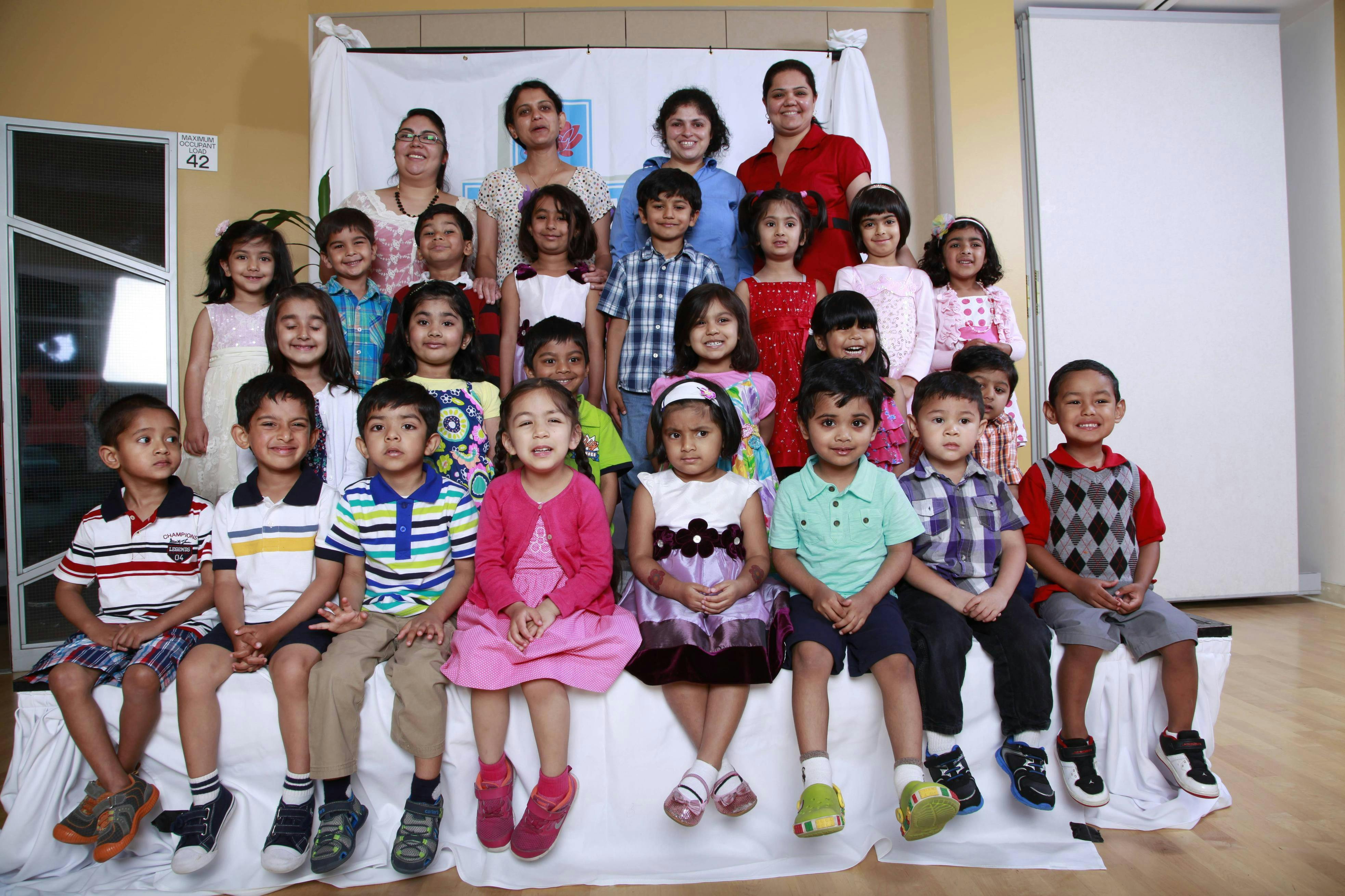 Group of adults and children posing for a photo