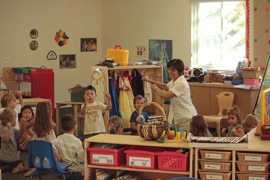 Adult and children in a classroom