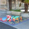 Play mat with toys on a sidewalk