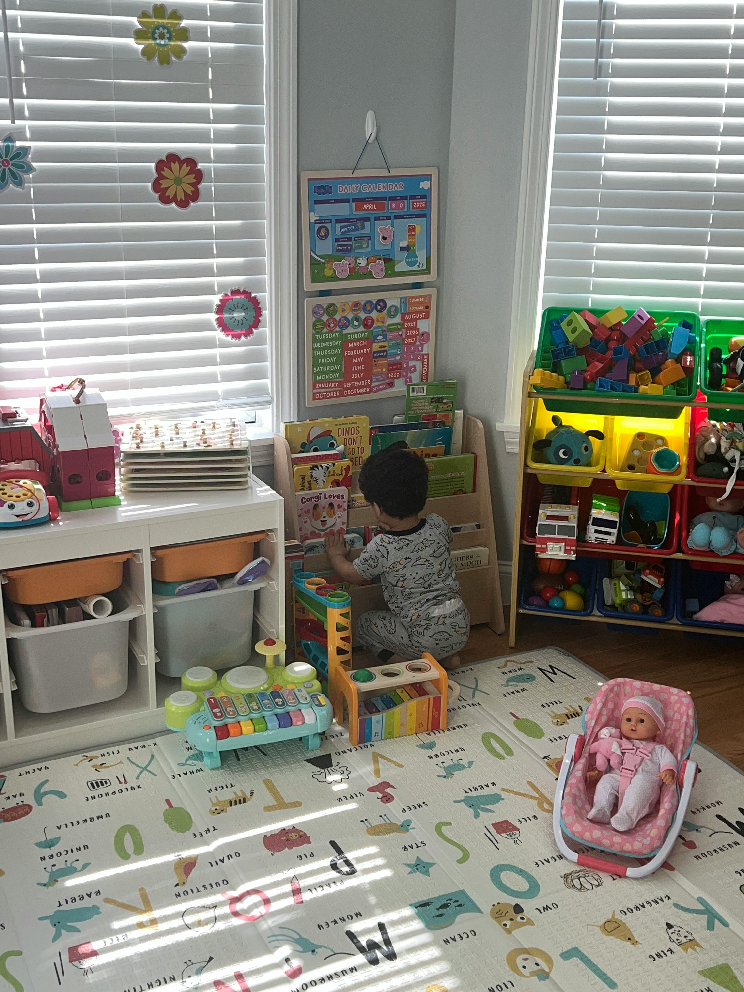 Child playing with toys in a playroom