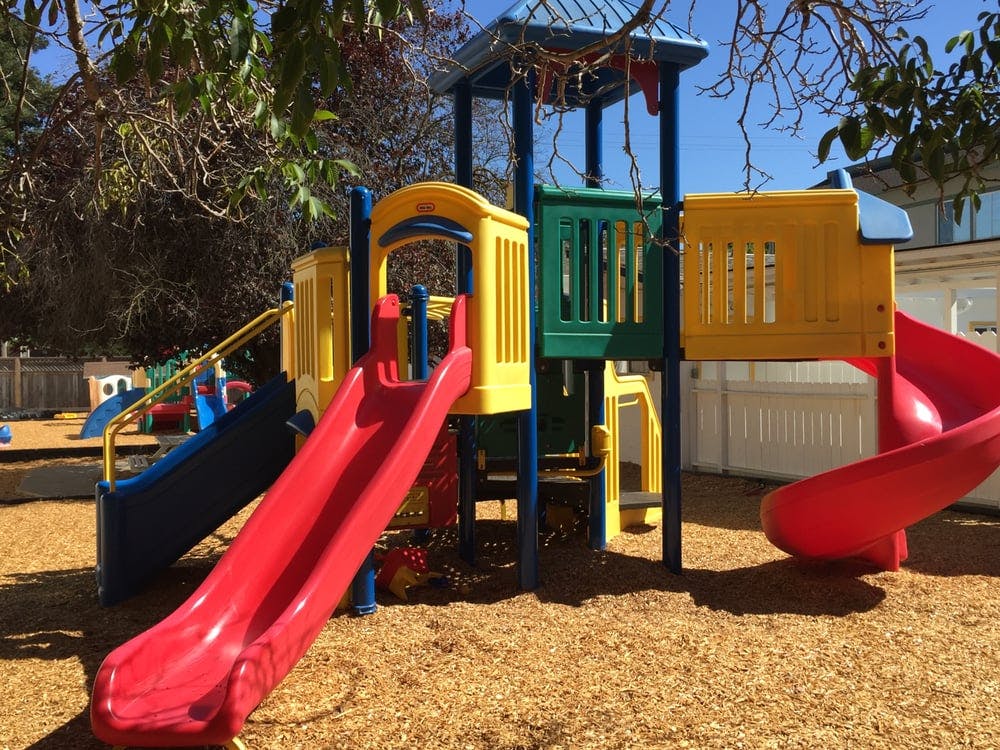 Colorful playground structure with multiple slides