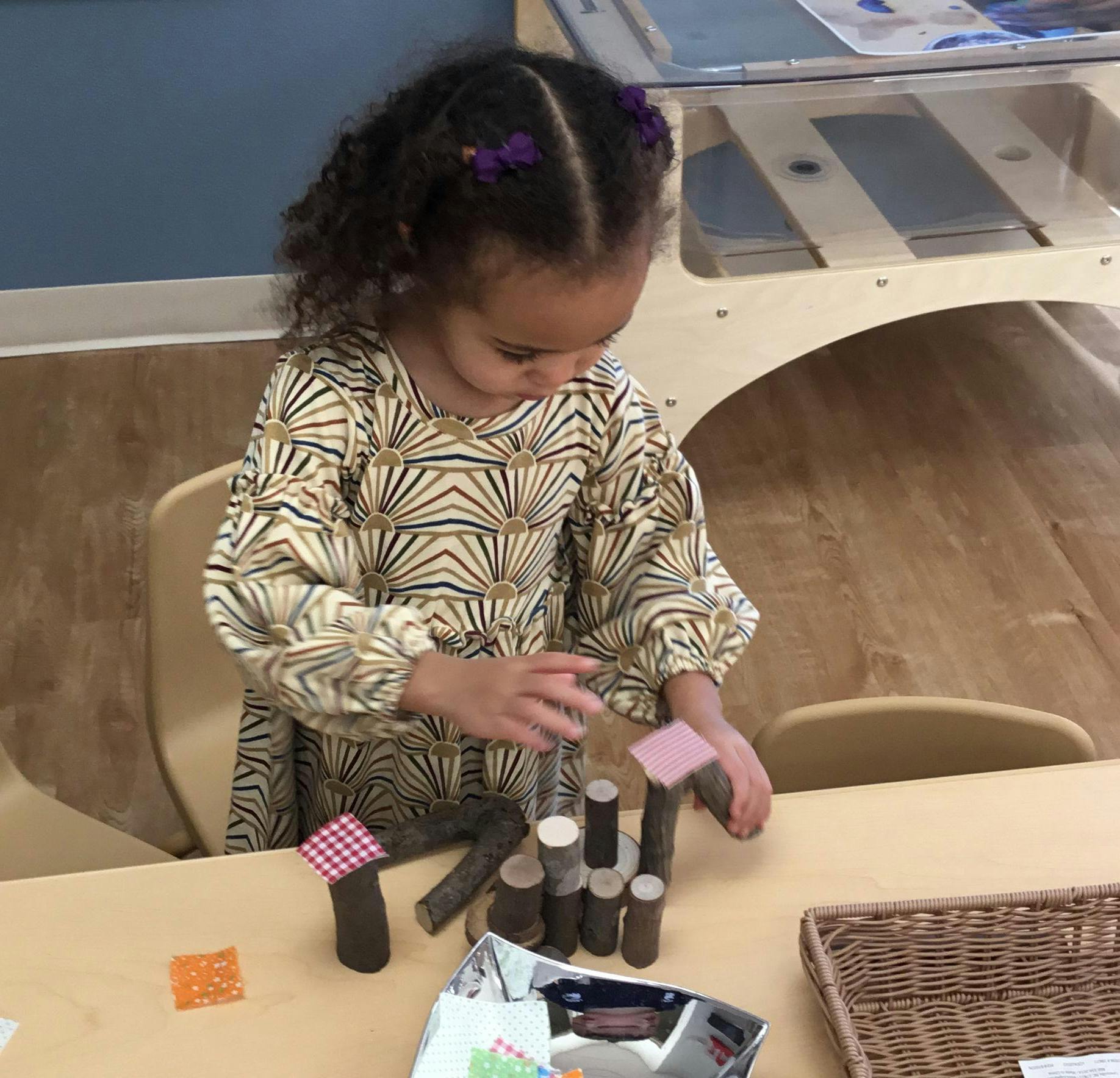 Child playing with blocks at a table