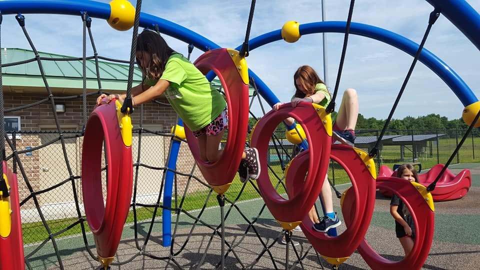 Children climbing on playground equipment