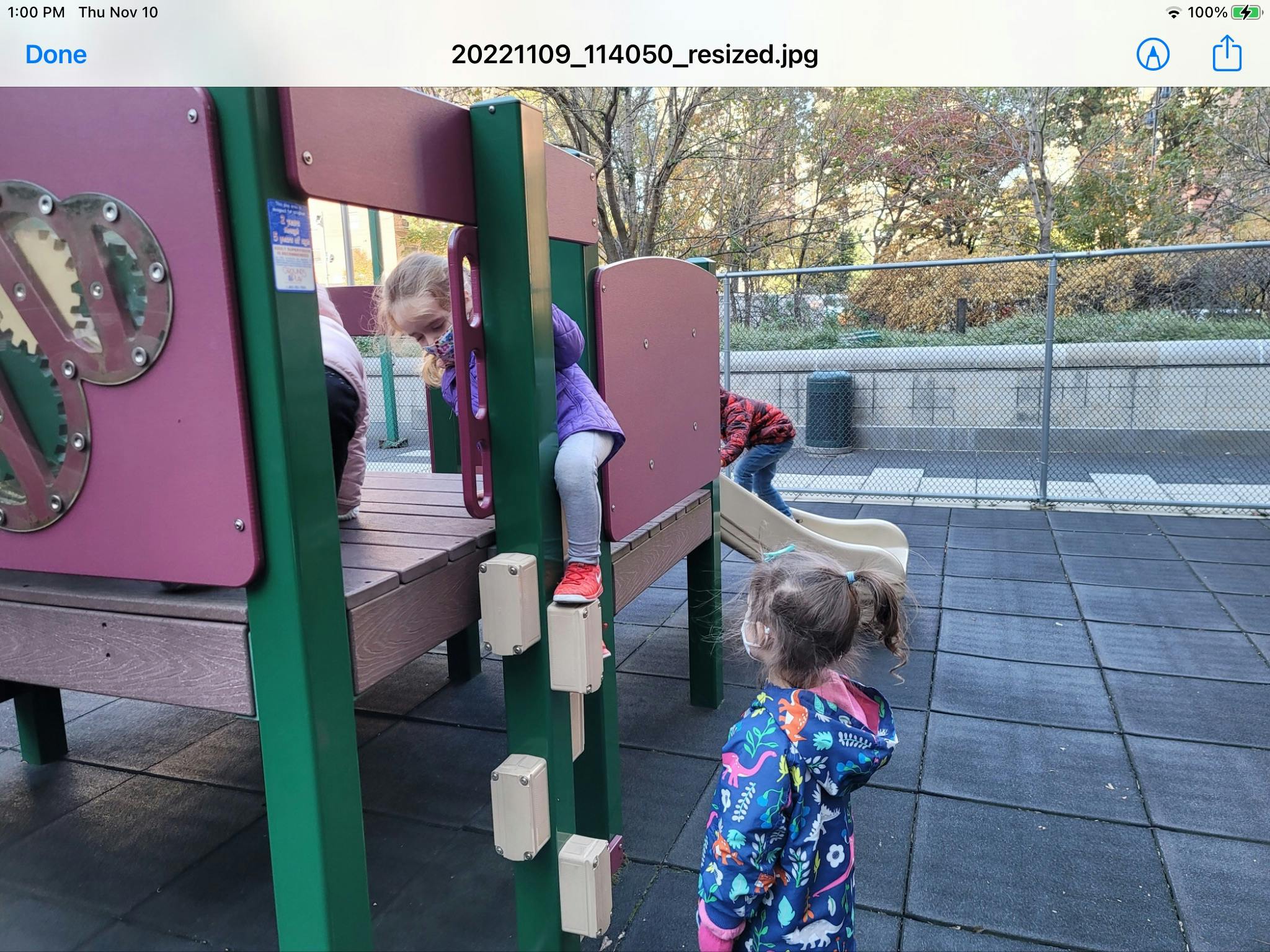 Children playing on a playground structure