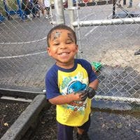Child with face paint smiling