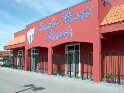 Red building with "Lincoln-Marti Schools" in blue text