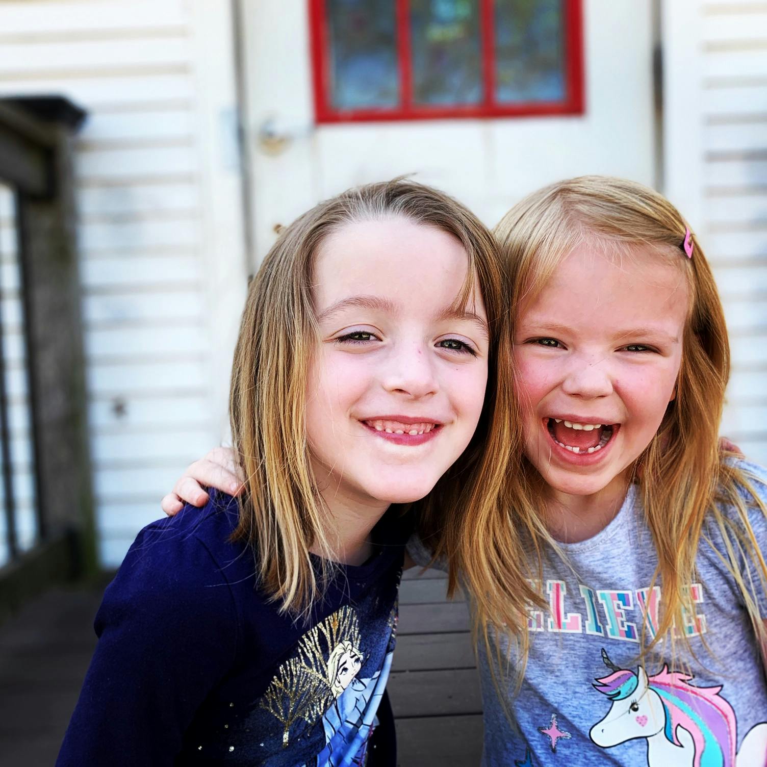 Two children smiling and laughing