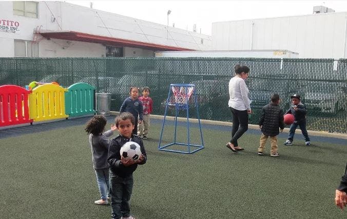 Children playing with balls on a playground