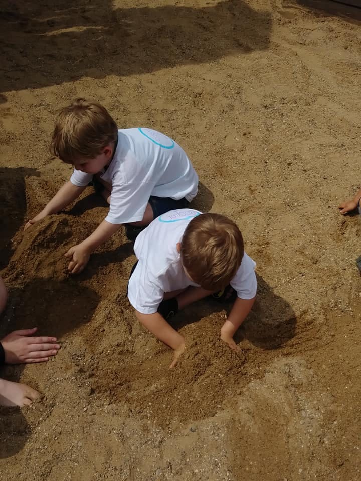 Two children playing in sand