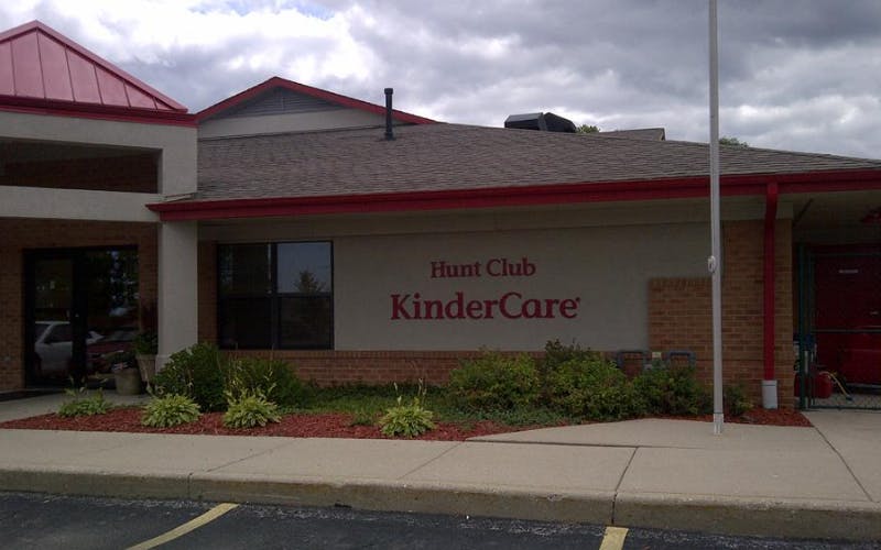 Exterior of a building with \"Hunt Club KinderCare\" on the wall