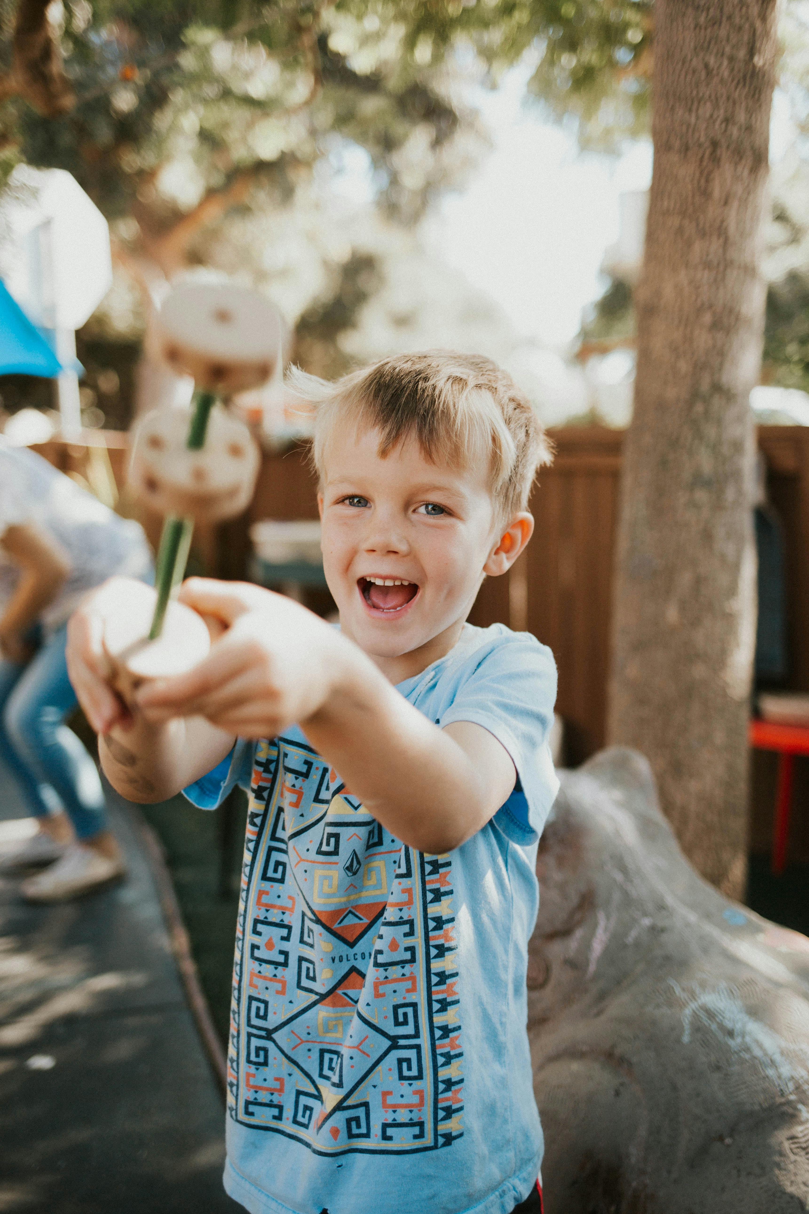 Child holding a toy on a stick